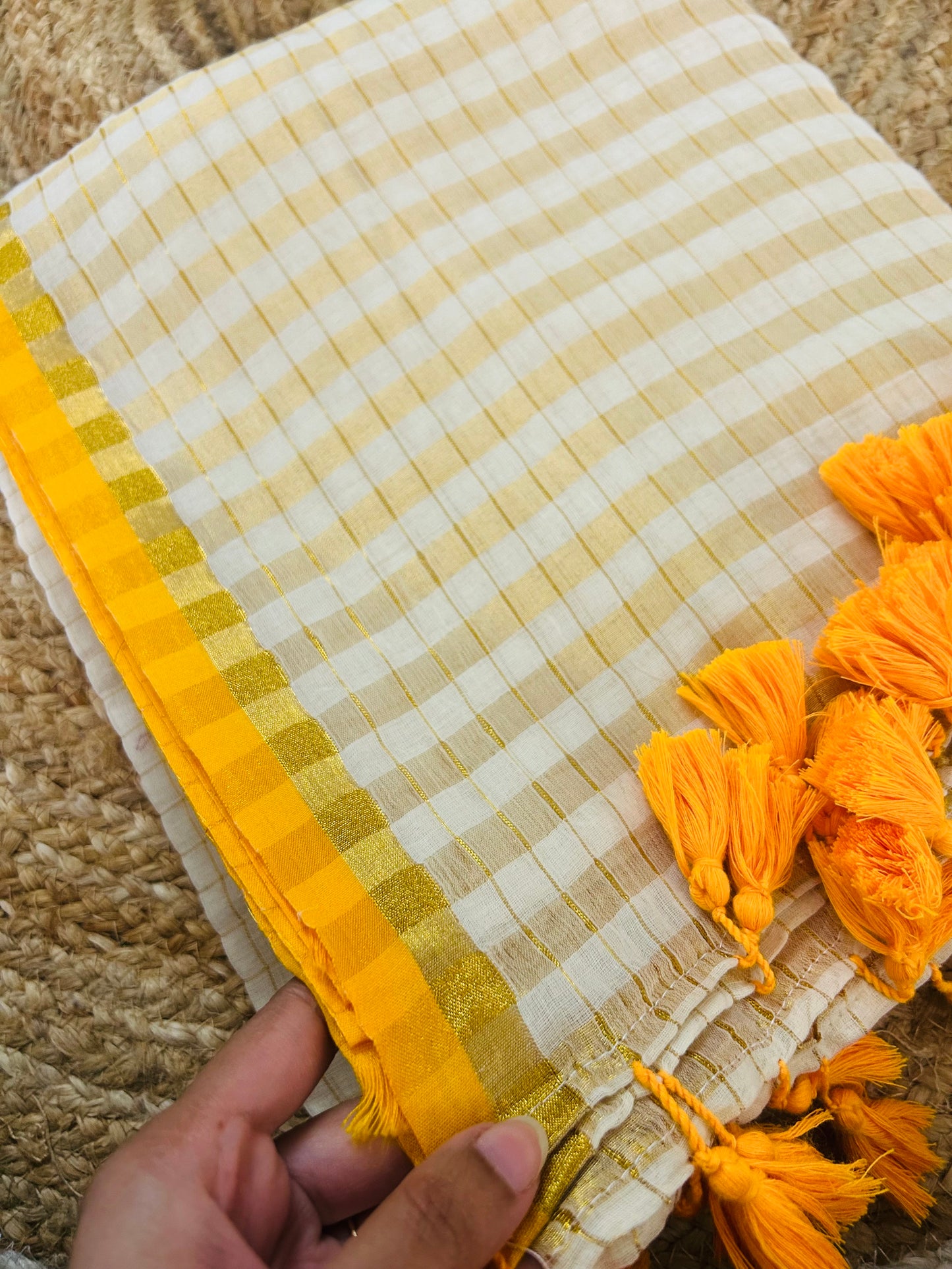 Pure and authentic mul cotton saree with zari checks all over and small mango yellow zari border