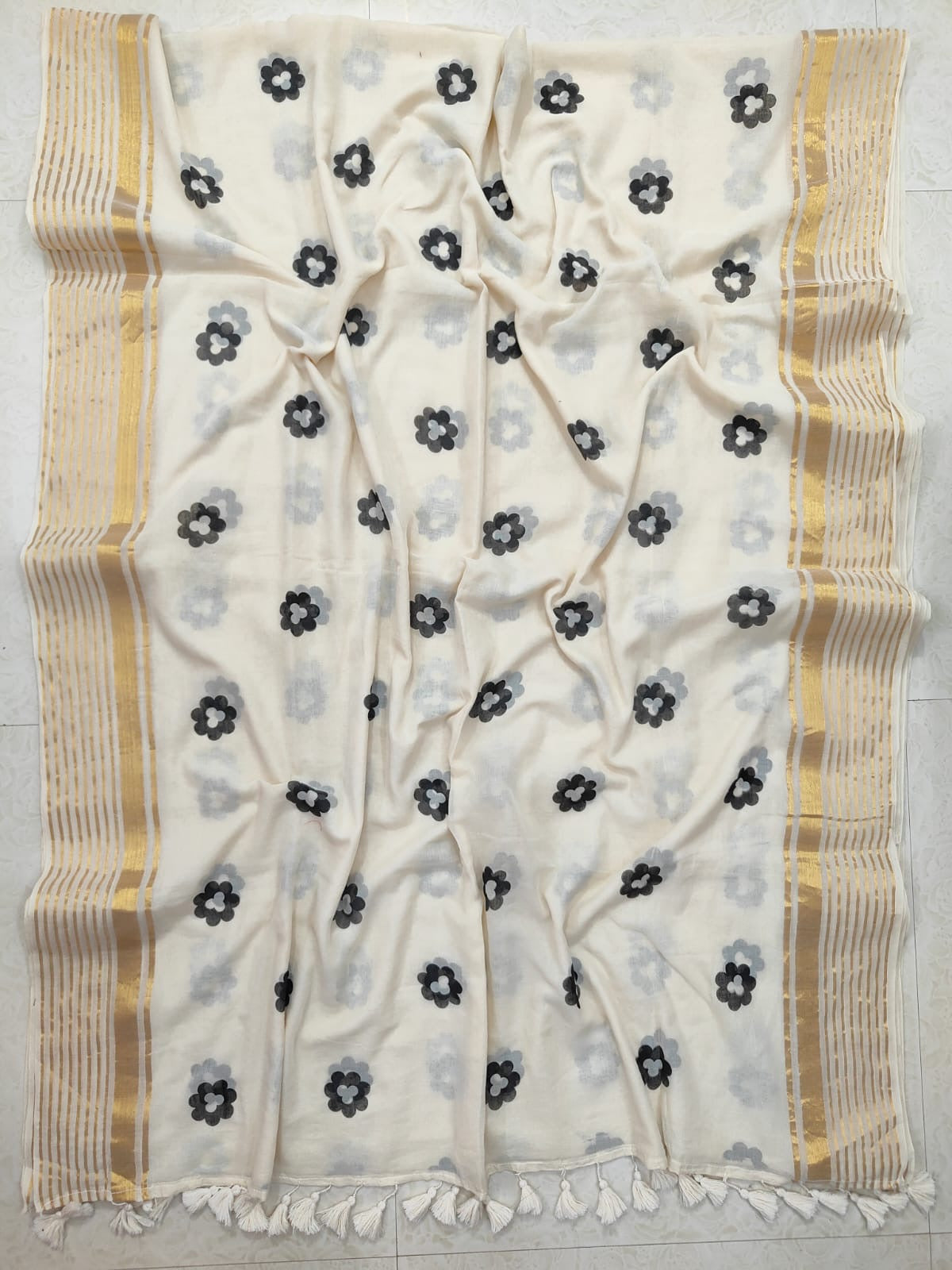 Pure and authentic mul cotton saree with black flowers