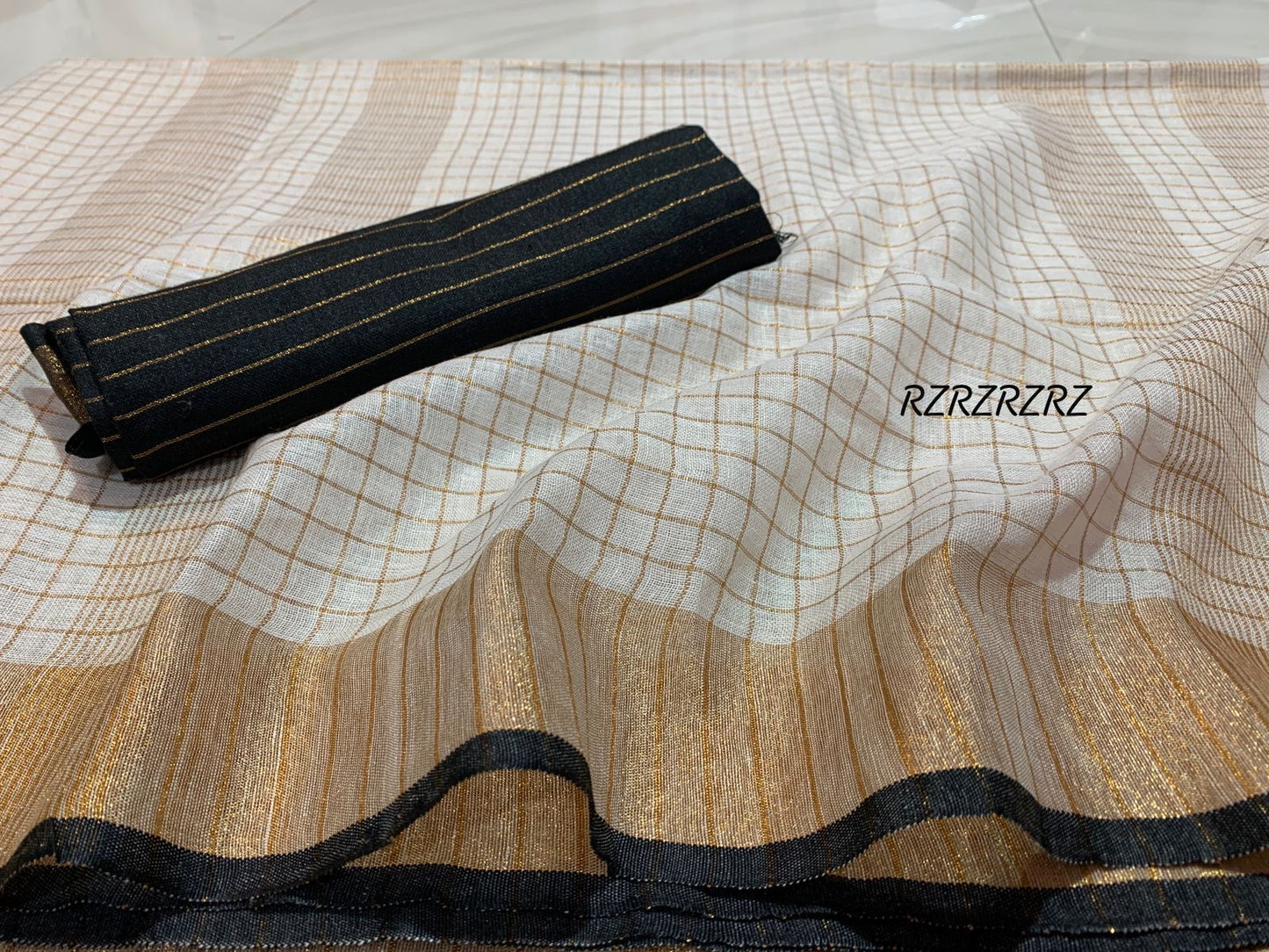 Pure linen checks saree with contrast blouse