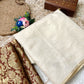 Beautiful semi chanderi silk saree with gold zari checks paired with brown Banarasi brocade blouse