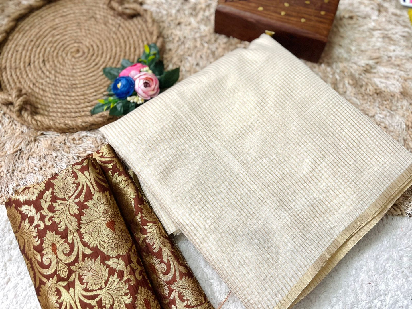 Beautiful semi chanderi silk saree with gold zari checks paired with brown Banarasi brocade blouse