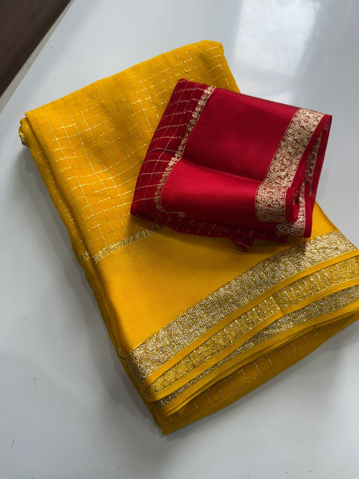 Beautiful viscous georgette saree with checks body and running blouse