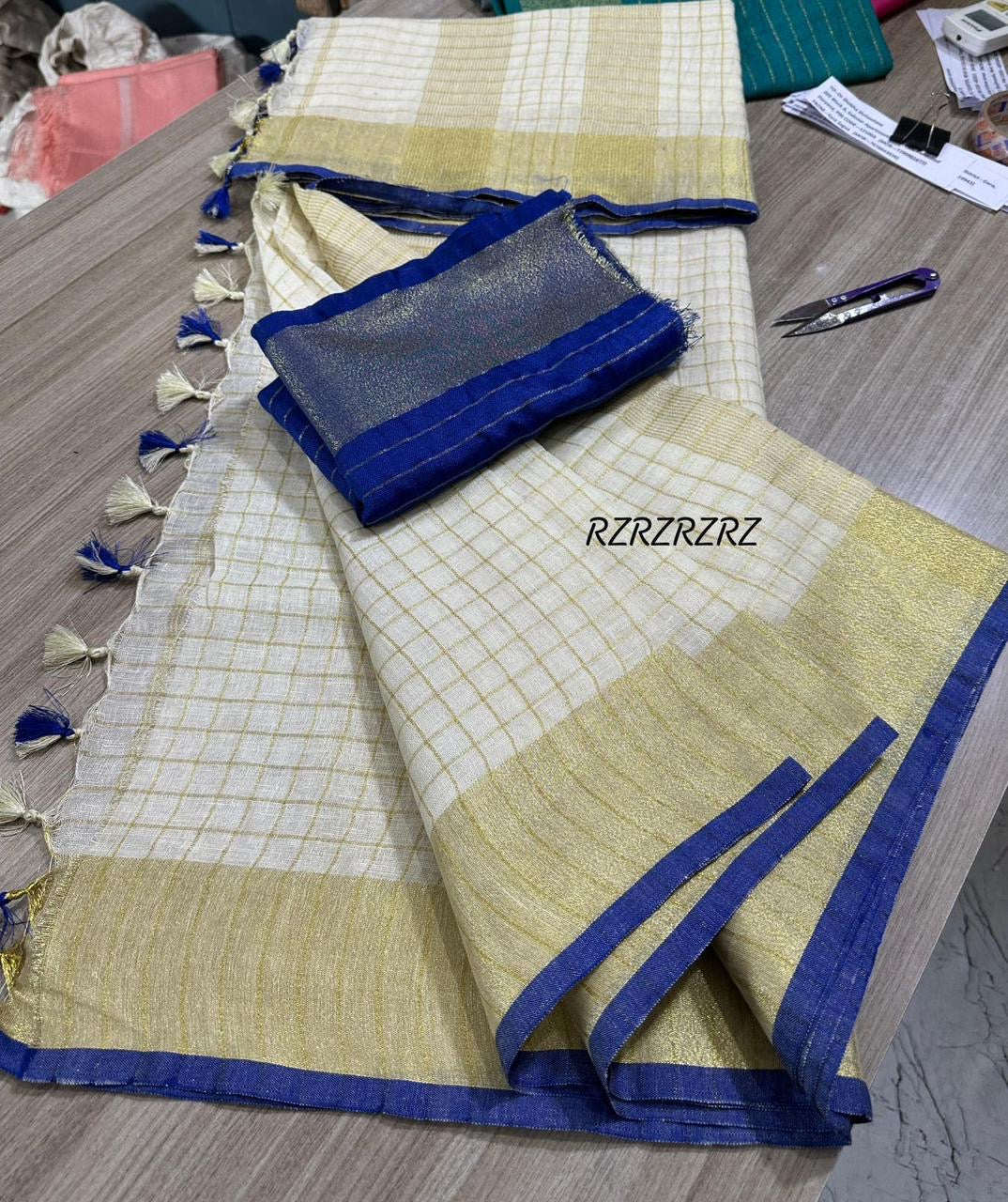 Pure linen checks saree with contrast blouse
