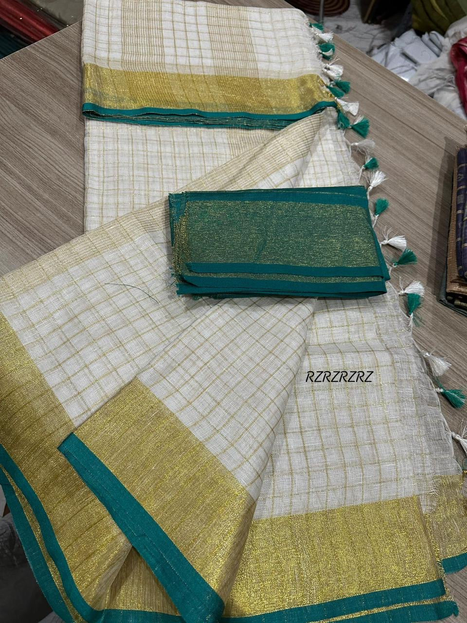Pure linen checks saree with contrast blouse