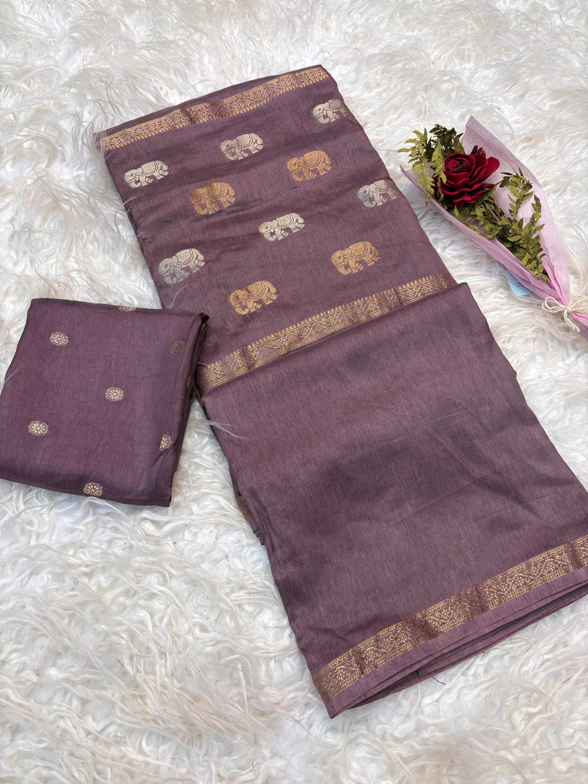 Soft viscous dola silk with beautiful silver and gold elephant motifs in the middle
